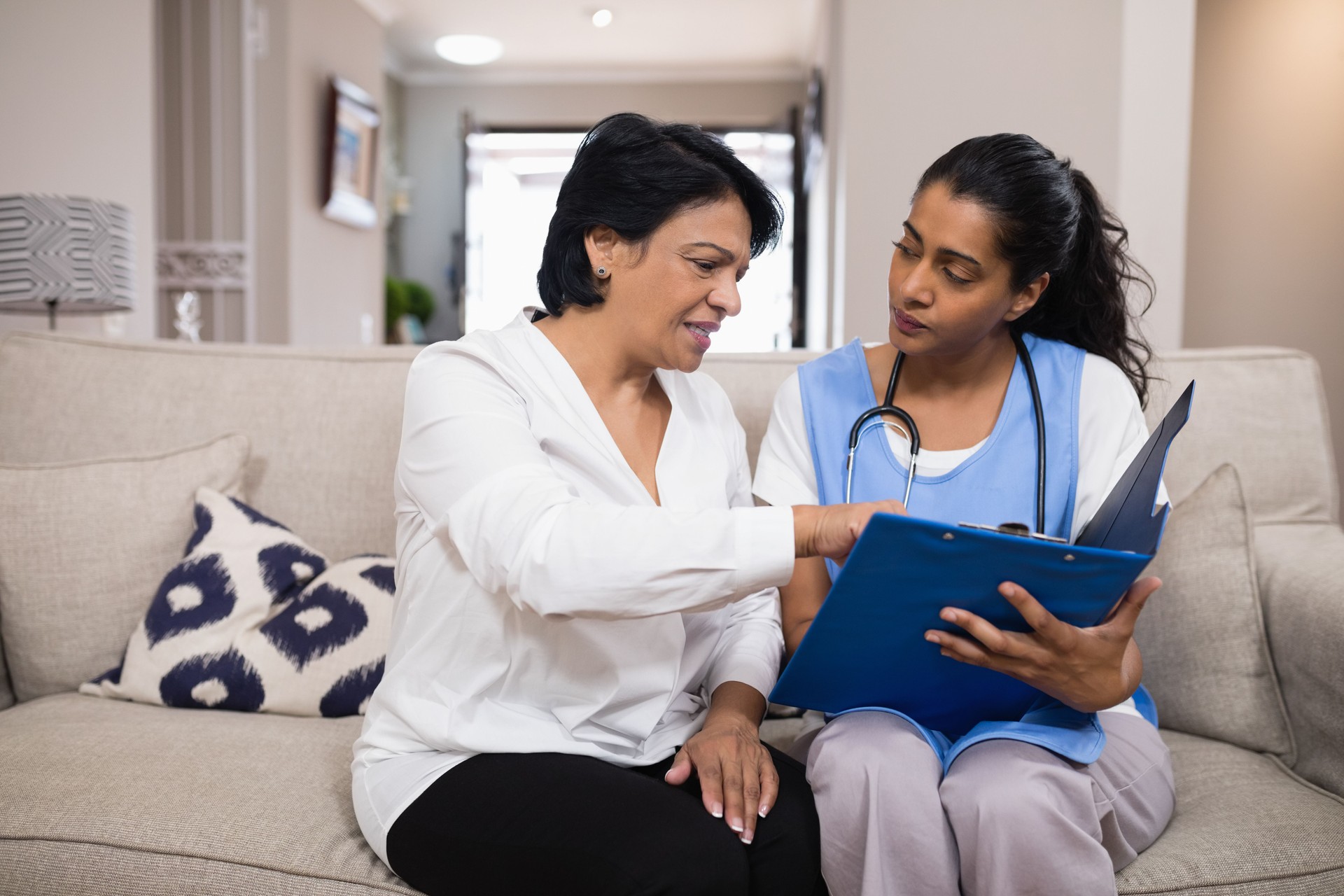 Patient discussing over medical report with doctor